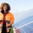 IEEE-USA: Strengthening the Stance of Women in Engineering (Woman in orange jacket, Electrical Engineer, Solar Panel Farm)